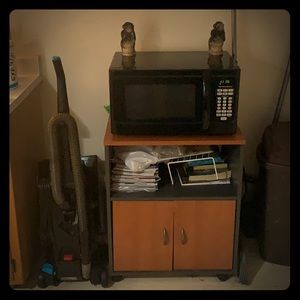 Selling microwave and cabinet  minus the junk lol